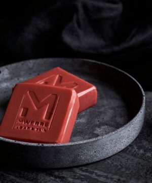 Indigenous Red clay square shaped soaps on a round gray plate